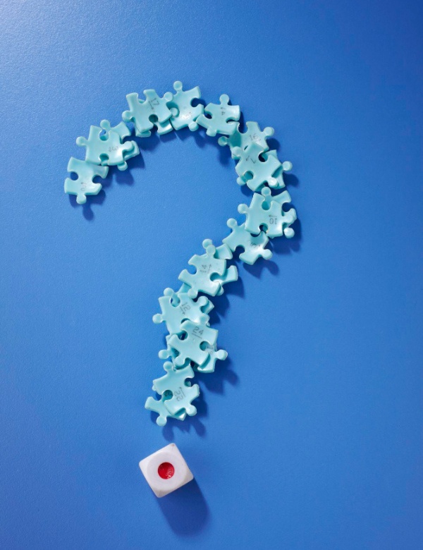 Puzzle pieces forming a question mark representing frequently asked questions section
